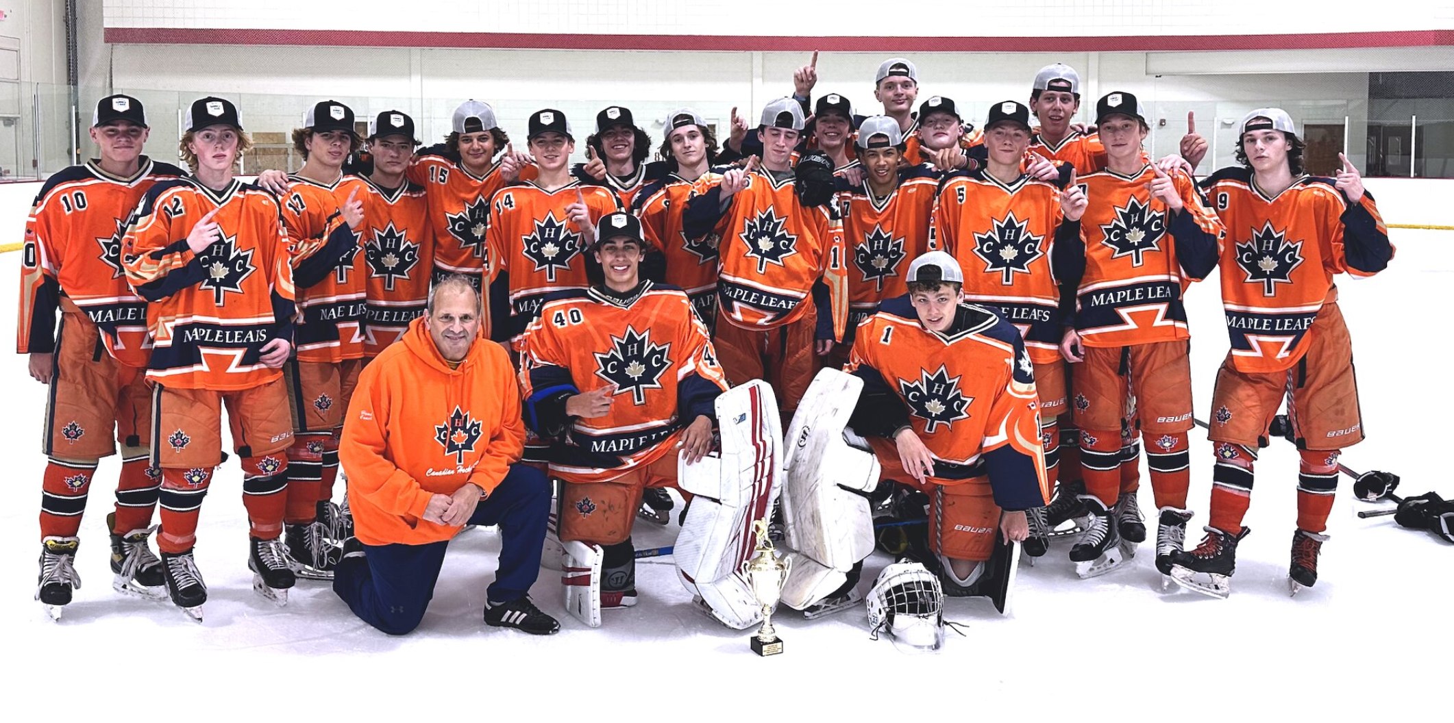 CHC team photo celebrating their 2023 Tier 2 NESC Orange championship