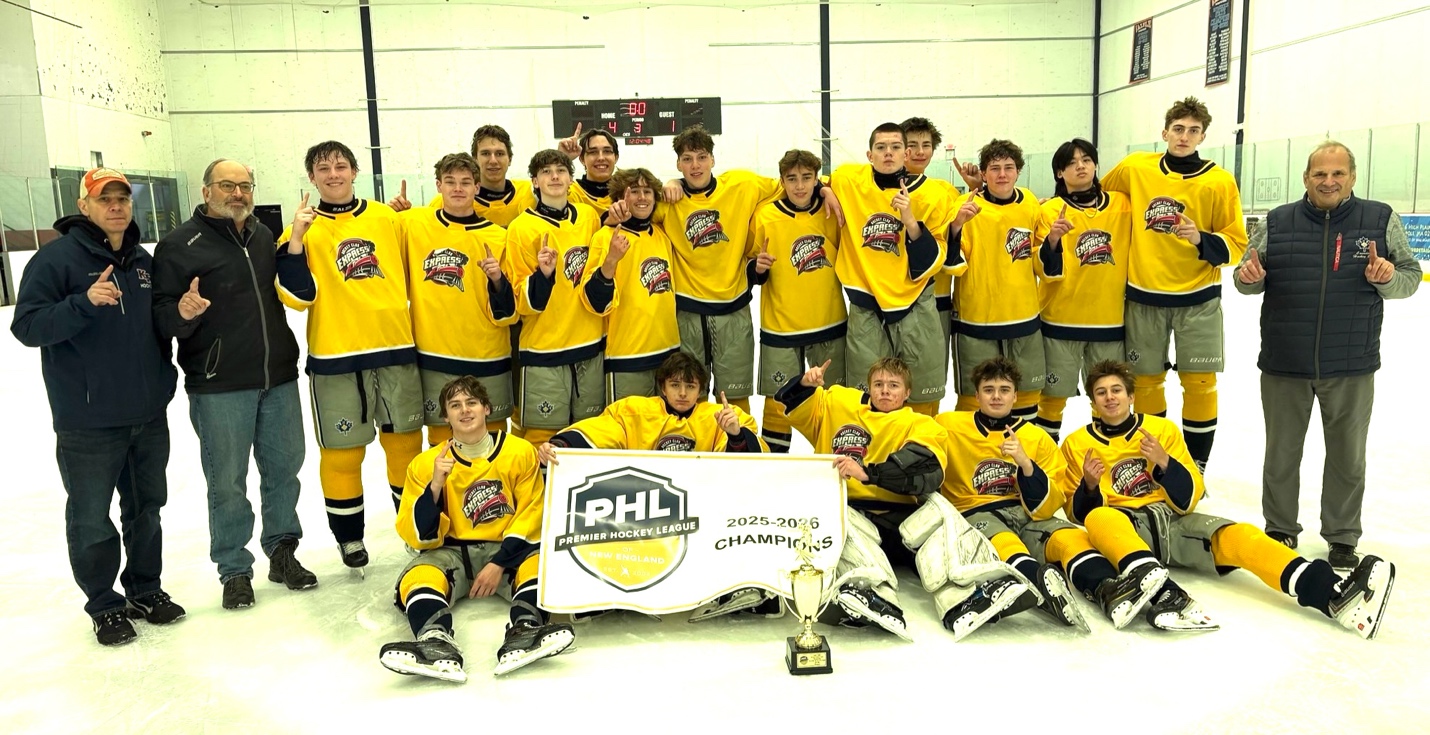 CHC fall team celebrating the PHL U18 Elite championship with the league banner and trophy